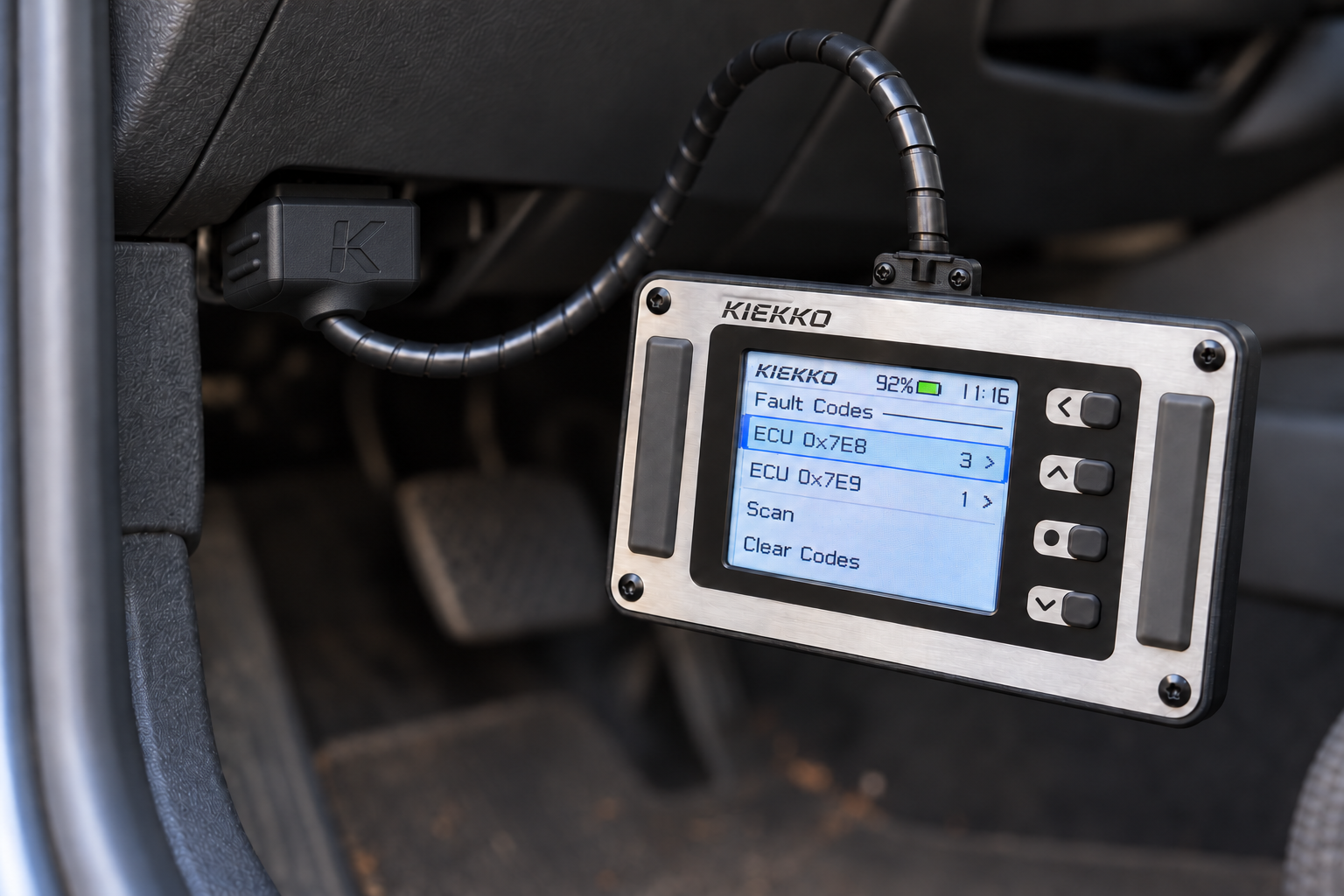 KIEKKO connected to a vehicle OBD port and displaying diagnostic information